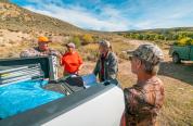 Game warden checking hunters